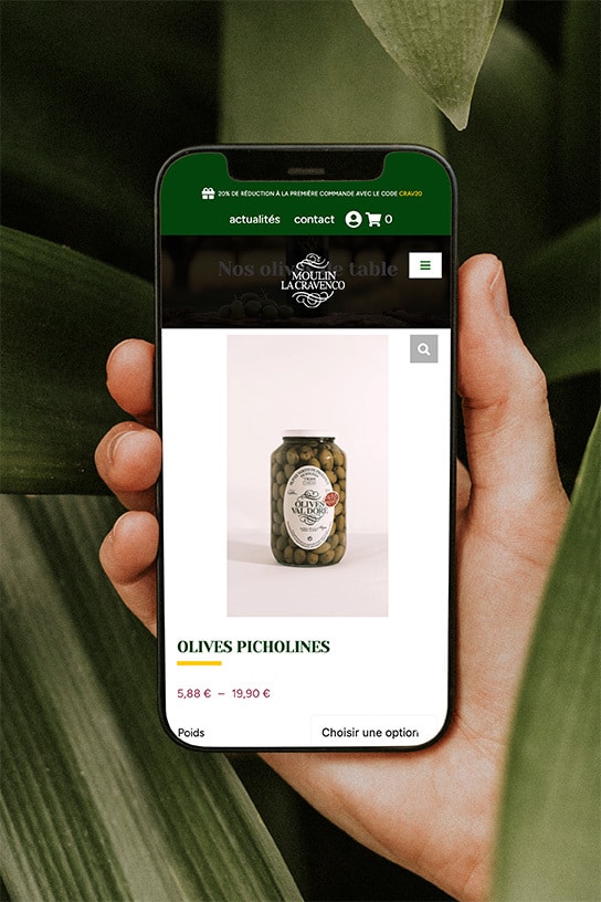 Écran de smartphone affichant la boutique en ligne (e-commerce) du Moulin La Cravenco.